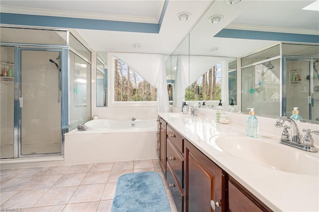 full bath with tile patterned floors, a garden tub, a stall shower, ornamental molding, and a sink