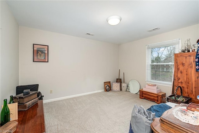 interior space with carpet, visible vents, and baseboards