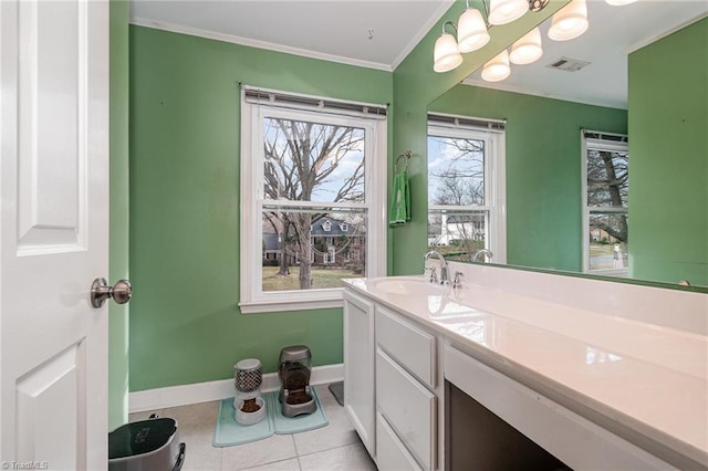 bathroom featuring vanity, baseboards, visible vents, ornamental molding, and tile patterned floors