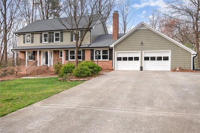 view of front facade with a front yard, an attached garage, a chimney, concrete driveway, and brick siding