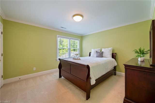 bedroom featuring crown molding, baseboards, visible vents, and light carpet
