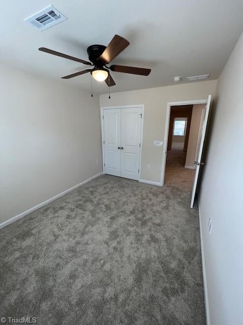 unfurnished bedroom featuring a closet, ceiling fan, and carpet floors