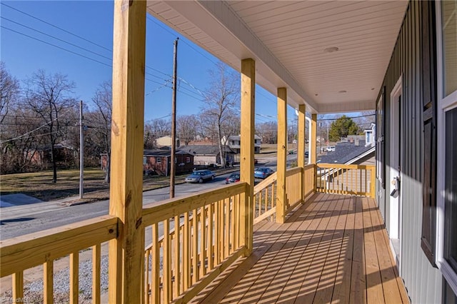 wooden terrace featuring covered porch