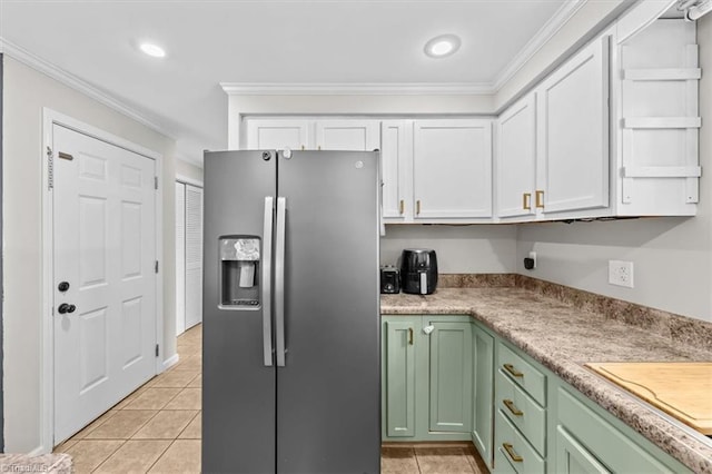 924 Delta Dr, Randleman, NC 27317 - kitchen featuring stainless steel fridge with ice dispenser, green cabinets, white cabinetry, light tile patterned floors, and crown molding