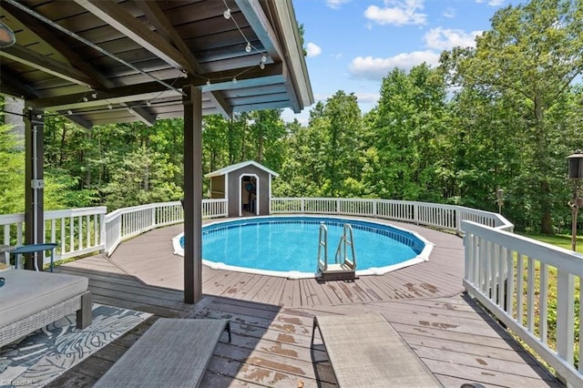 924 Delta Dr, Randleman, NC 27317 - view of swimming pool with a wooden deck, a storage shed, and view of scattered trees