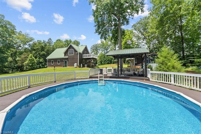 924 Delta Dr, Randleman, NC 27317 - swimming pool featuring a deck, a gazebo, a lawn, and view of wooded area