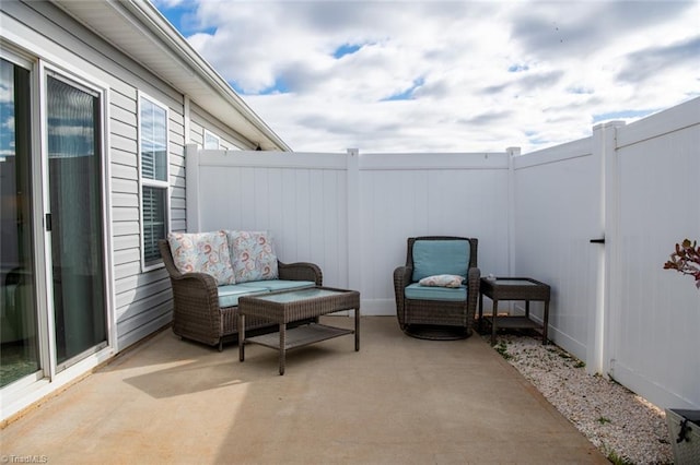 view of patio featuring fence