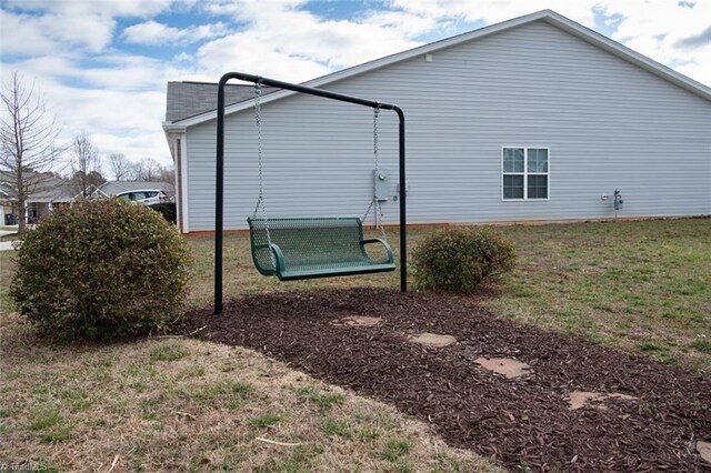 view of property exterior featuring a lawn