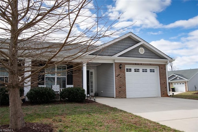 view of front facade with brick siding, driveway, a front lawn, and a garage