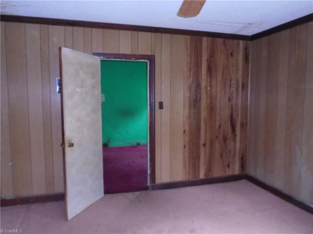 815 Camel Ave, Winston-Salem, NC 27101 - carpeted spare room featuring wood walls