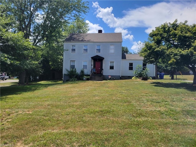 colonial home with a front yard