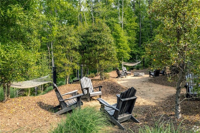 view of yard with a fire pit