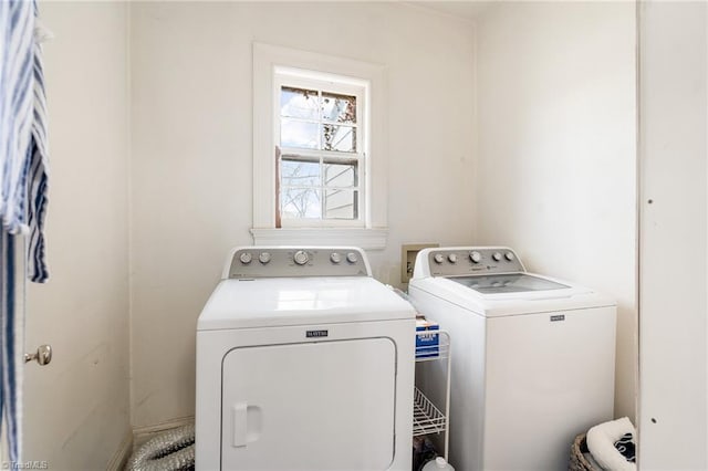 washroom featuring laundry area and washer and dryer