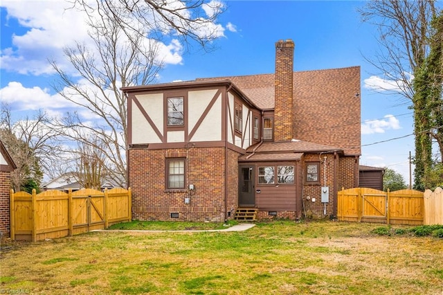 rear view of property with stucco siding, entry steps, crawl space, a gate, and a fenced backyard