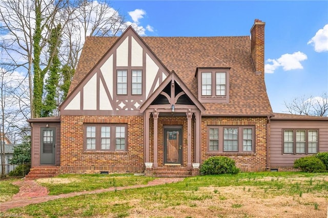 view of front of house featuring entry steps, a shingled roof, crawl space, and a chimney