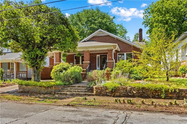 119 Wiley Ave, Salisbury, NC 28144 - view of front of home featuring brick siding, a porch, and a chimney
