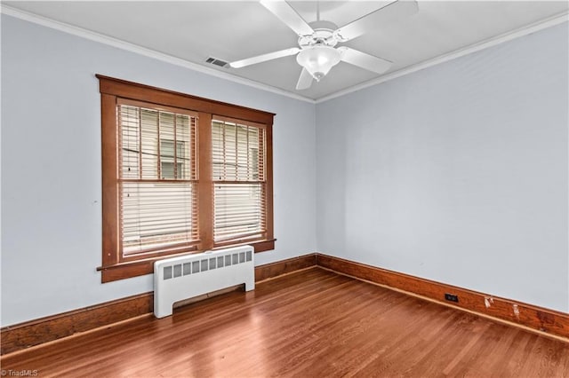 119 Wiley Ave, Salisbury, NC 28144 - unfurnished room with radiator heating unit, wood finished floors, baseboards, ornamental molding, and a ceiling fan