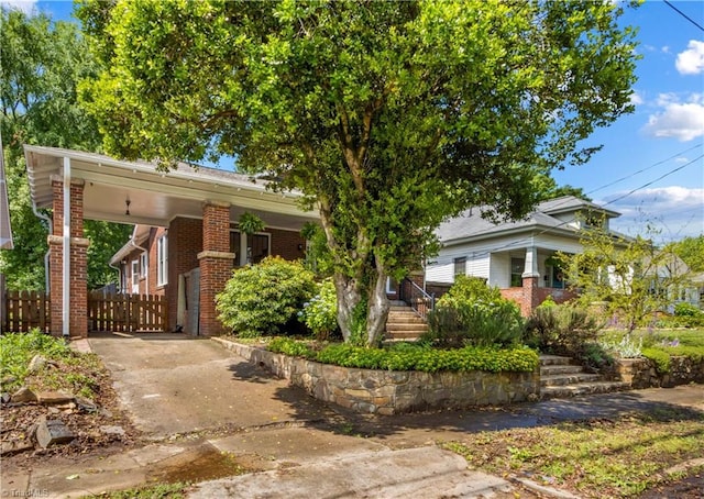 119 Wiley Ave, Salisbury, NC 28144 - view of front of house with driveway, brick siding, and an attached carport
