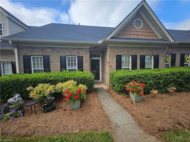 1627 Crestlawn Trl, Pfafftown, NC 27040 - view of front of house featuring a shingled roof and brick siding