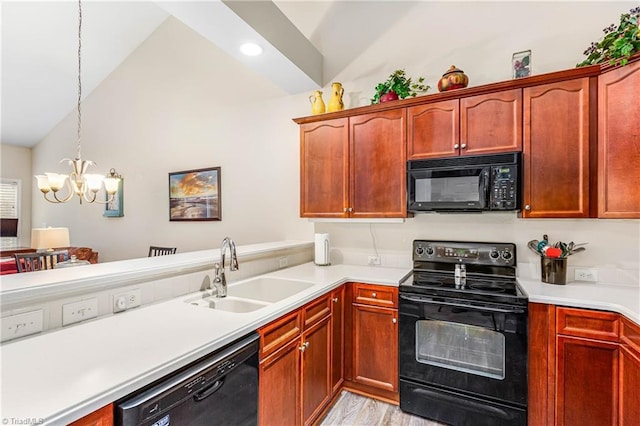1627 Crestlawn Trl, Pfafftown, NC 27040 - kitchen with black appliances, a sink, lofted ceiling, light countertops, and a chandelier