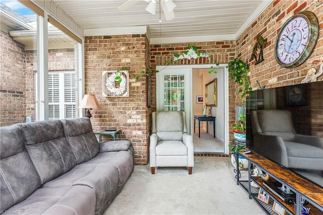 1627 Crestlawn Trl, Pfafftown, NC 27040 - living area with brick wall, healthy amount of natural light, light carpet, and ceiling fan