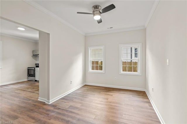 empty room with ceiling fan, light hardwood / wood-style floors, and ornamental molding