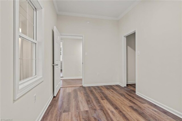 bathroom with walk in shower, toilet, hardwood / wood-style flooring, and vaulted ceiling