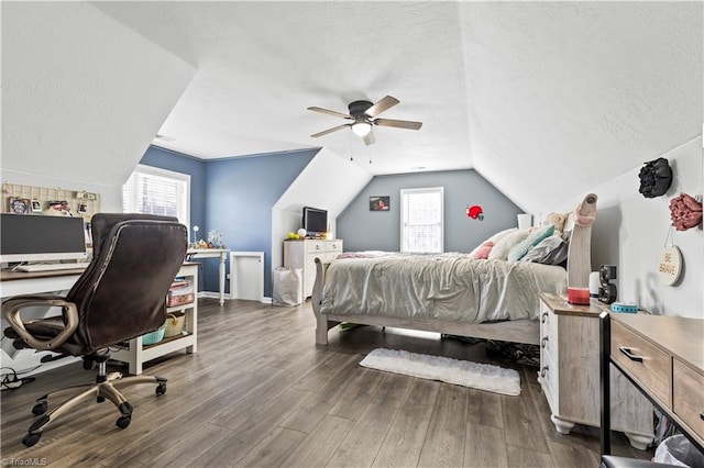 bedroom with vaulted ceiling, wood finished floors, and a ceiling fan