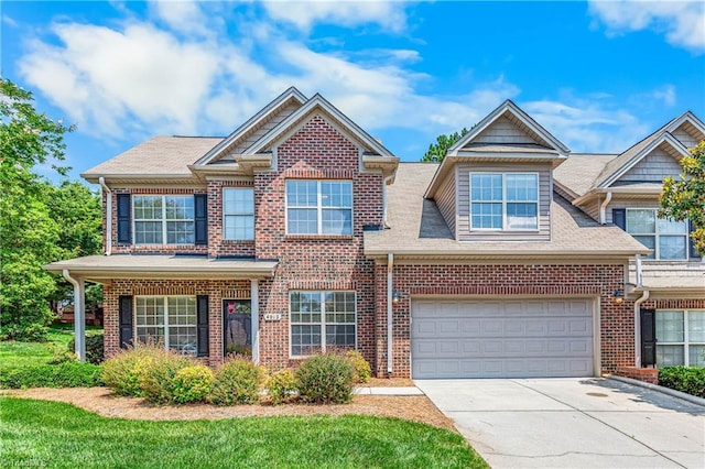 4012 Chianti Way, Greensboro, NC 27410 - view of front of home featuring concrete driveway, brick siding, a shingled roof, and an attached garage