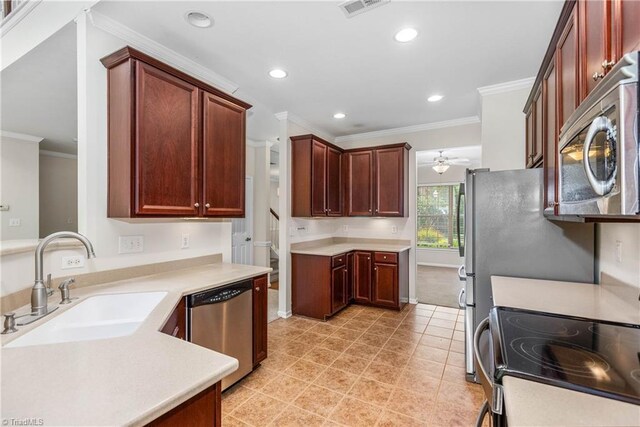 4012 Chianti Way, Greensboro, NC 27410 - kitchen with stainless steel appliances, a sink, crown molding, a ceiling fan, and recessed lighting