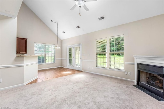 4012 Chianti Way, Greensboro, NC 27410 - unfurnished living room with light carpet, high vaulted ceiling, a ceiling fan, a fireplace with flush hearth, and plenty of natural light