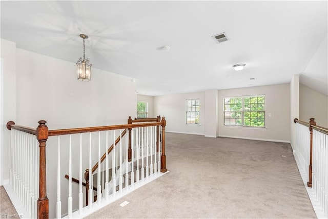 4012 Chianti Way, Greensboro, NC 27410 - hallway with an upstairs landing, carpet floors, and baseboards