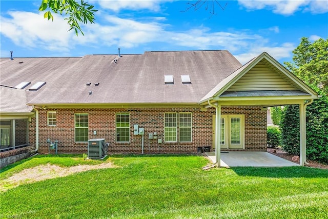 4012 Chianti Way, Greensboro, NC 27410 - back of property featuring a patio, central air condition unit, brick siding, and a lawn