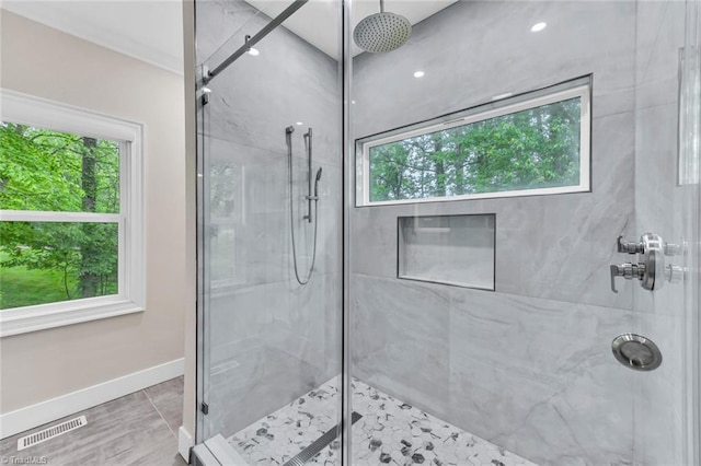 104 Shawnee Cir, Lexington, NC 27295 - bathroom featuring visible vents, a wealth of natural light, and a marble finish shower