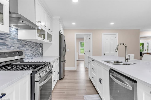 104 Shawnee Cir, Lexington, NC 27295 - kitchen with wall chimney range hood, stainless steel appliances, a sink, and light countertops