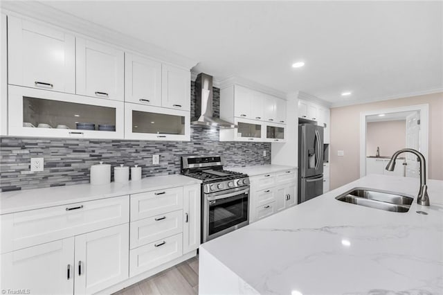104 Shawnee Cir, Lexington, NC 27295 - kitchen with wall chimney range hood, white cabinets, stainless steel appliances, and a sink