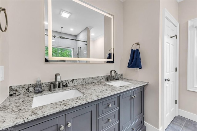 104 Shawnee Cir, Lexington, NC 27295 - bathroom with a sink, baseboards, a stall shower, and double vanity