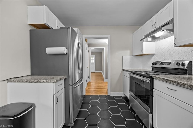 kitchen with under cabinet range hood, white cabinetry, appliances with stainless steel finishes, and tasteful backsplash