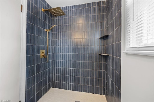 full bath featuring a tile shower