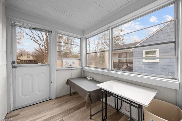 sunroom featuring wooden ceiling