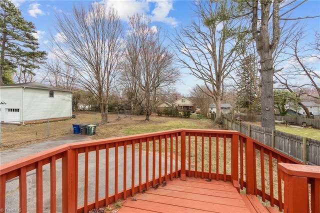 deck featuring a lawn and a fenced backyard