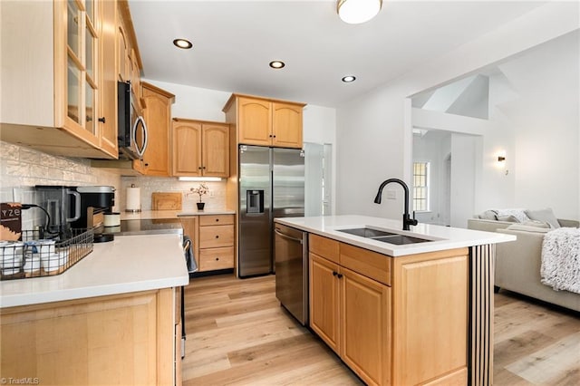 2264 Loflin Farlow Ln, Sophia, NC 27350 - kitchen featuring appliances with stainless steel finishes, light wood-type flooring, light brown cabinetry, backsplash, and recessed lighting
