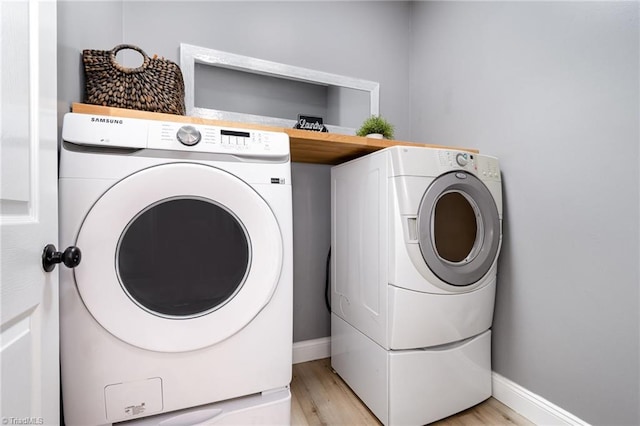 2264 Loflin Farlow Ln, Sophia, NC 27350 - laundry room featuring separate washer and dryer and light wood-style flooring