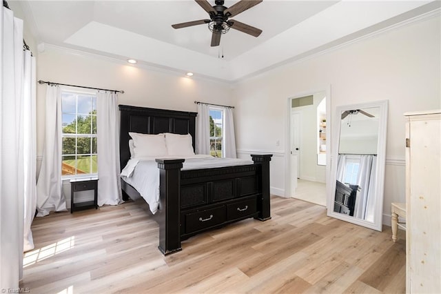 2264 Loflin Farlow Ln, Sophia, NC 27350 - bedroom featuring a raised ceiling, light wood-style floors, a wainscoted wall, ornamental molding, and a ceiling fan