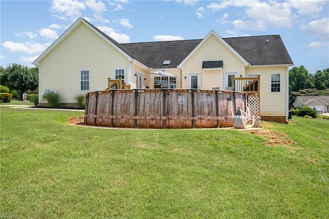 2264 Loflin Farlow Ln, Sophia, NC 27350 - rear view of house featuring a wooden deck, a lawn, and roof with shingles