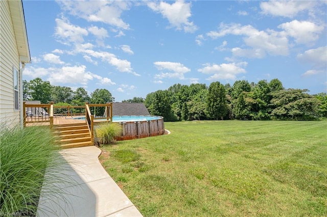 2264 Loflin Farlow Ln, Sophia, NC 27350 - view of grassy yard featuring a wooden deck and an outdoor pool