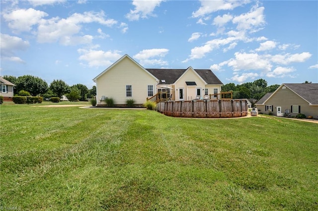 2264 Loflin Farlow Ln, Sophia, NC 27350 - rear view of house with a lawn and a wooden deck