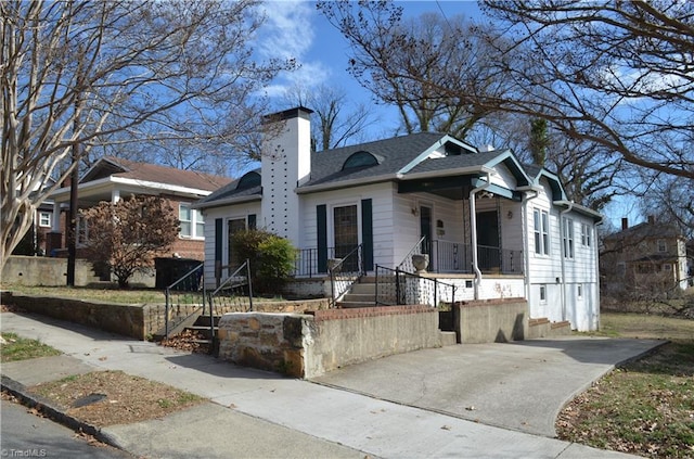 view of front of home featuring a chimney