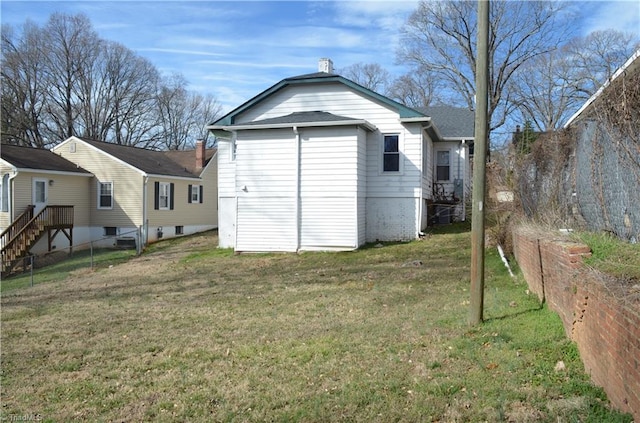 view of outbuilding with fence