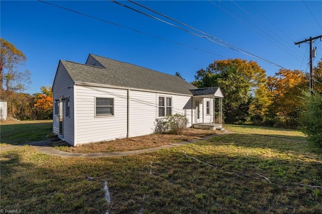 view of property exterior with a yard